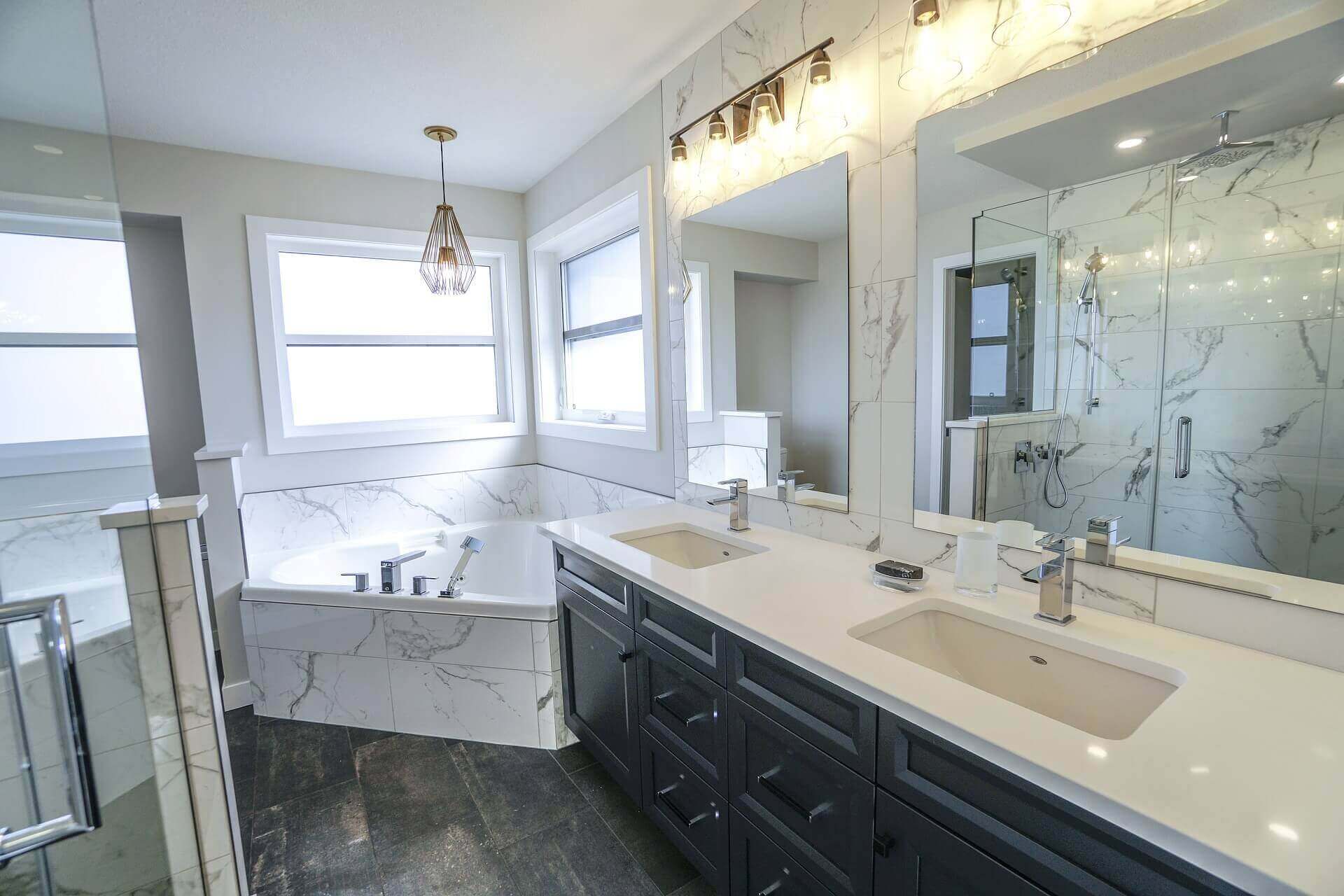 Luxurious bathroom with marble floor and dark wood cabinets