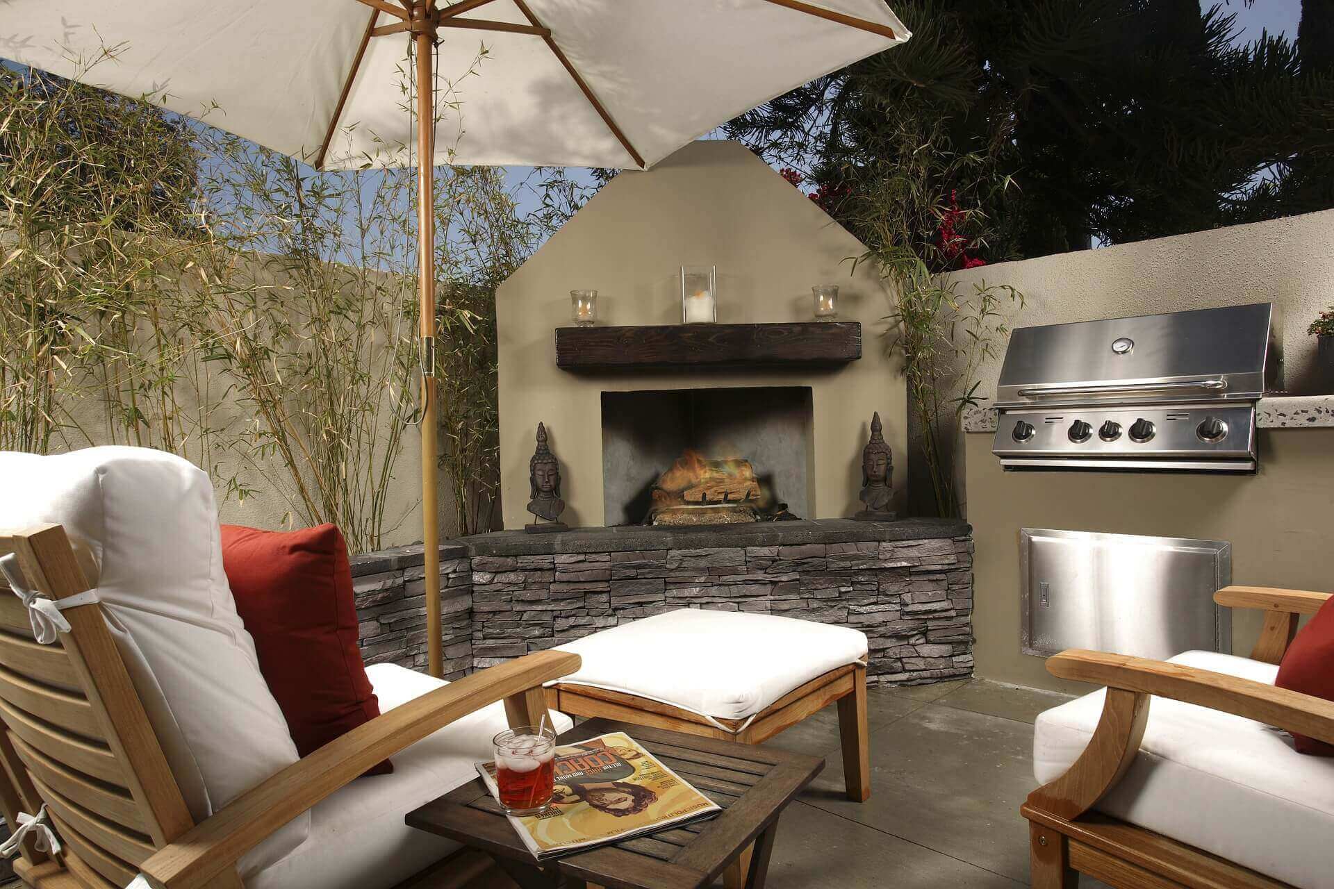 Custom Outdoor living space with built in grill and fireplace.